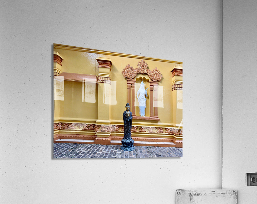 Statues on a Yellow Wall Acrylic Print