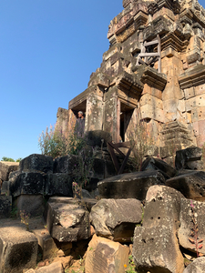 Man Looking Outside of Old Temple