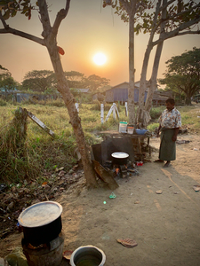 Cooking outside in Myanmar at Sunset