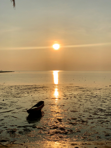 Lonely Boat at the Sunset