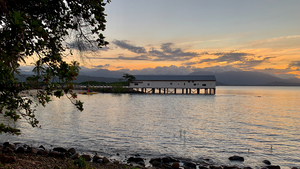 Long Building on Water during Sunset