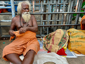 Man Sitting by the Temple