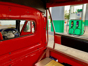 Red Truck at the Pump