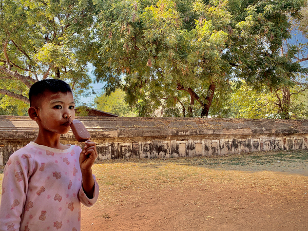 Myanmar Boy Eating a Frozen Candy Bar Print