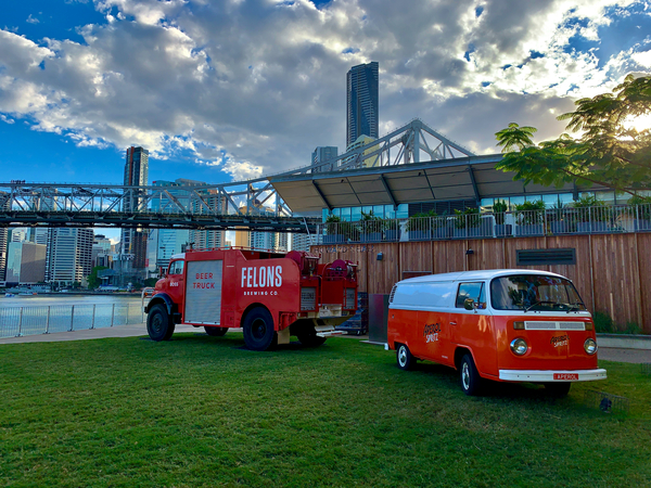 Red Trucks in Front of the Bridge Print