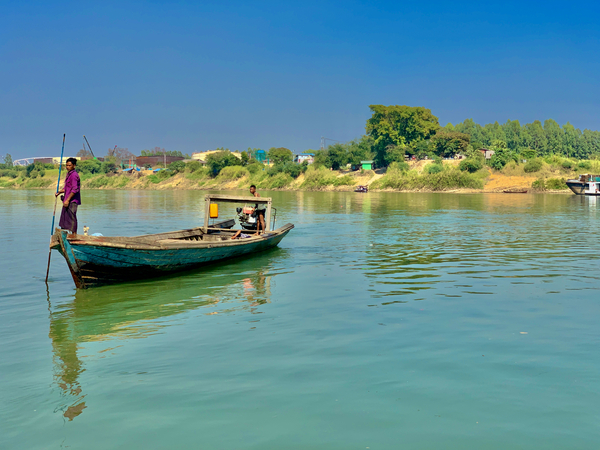 Standing in Front of the Boat Print