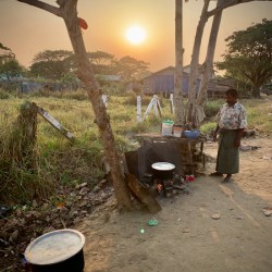 Cooking outside in Myanmar at Sunset