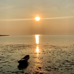 Lonely Boat at the Sunset