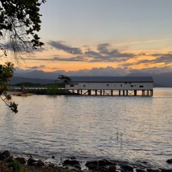Long Building on Water during Sunset