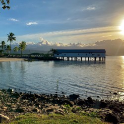 Long House on the Water at Sunset