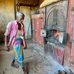 Man Fuelling Up the Fire