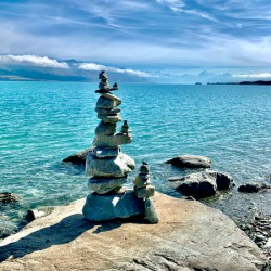Rock Balancing in Front of the Lake