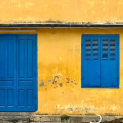 The Yellow House with Blue Windows and Door
